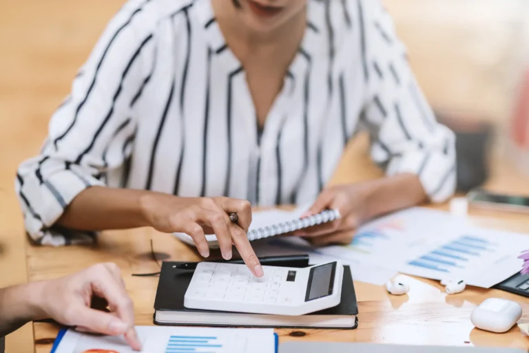 businesswoman-fingers-hand-using-a-calculator-2023-11-27-04-56-22-utc (Web H)