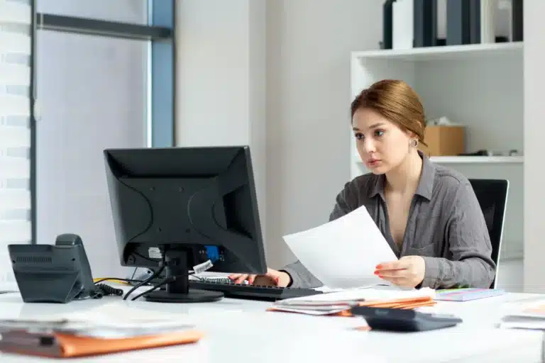 front-view-young-beautiful-lady-grey-shirt-working-her-pc-sitting-inside-her-office-daytime-building-job-activity (Web H)